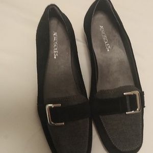 Black suede shoes with silver buckle